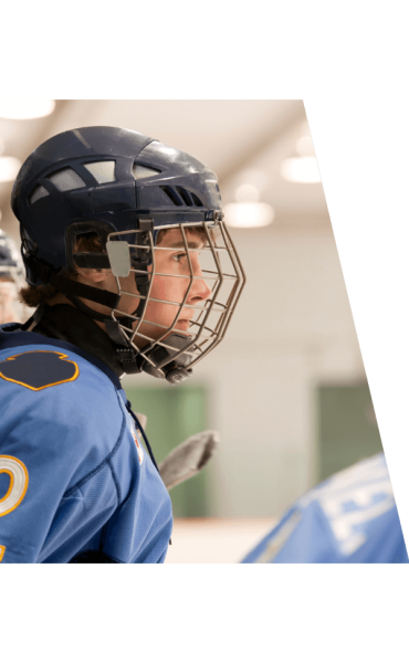 Youth hockey player with helmet looking to the right Summer Prep Hockey Sessions VI Storm Athletics