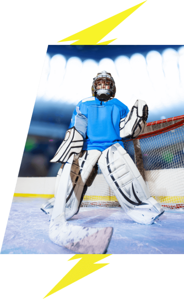 Kids goaltender in the net on the ice lightning bolt image accents VI Storm Athletics Goaltending Development