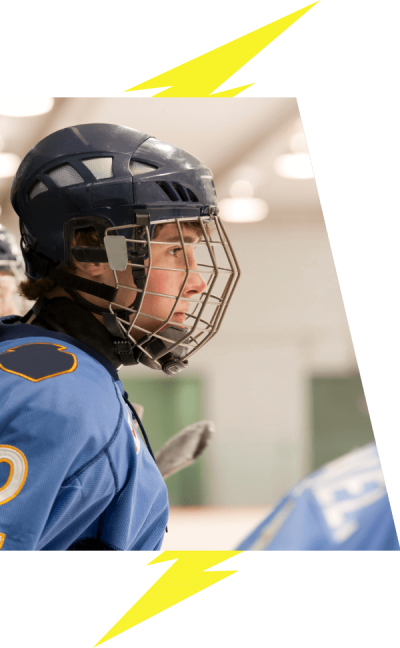 Side profile of a hockey player wearing blue.
