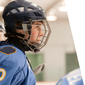 Side profile of a hockey player wearing blue.